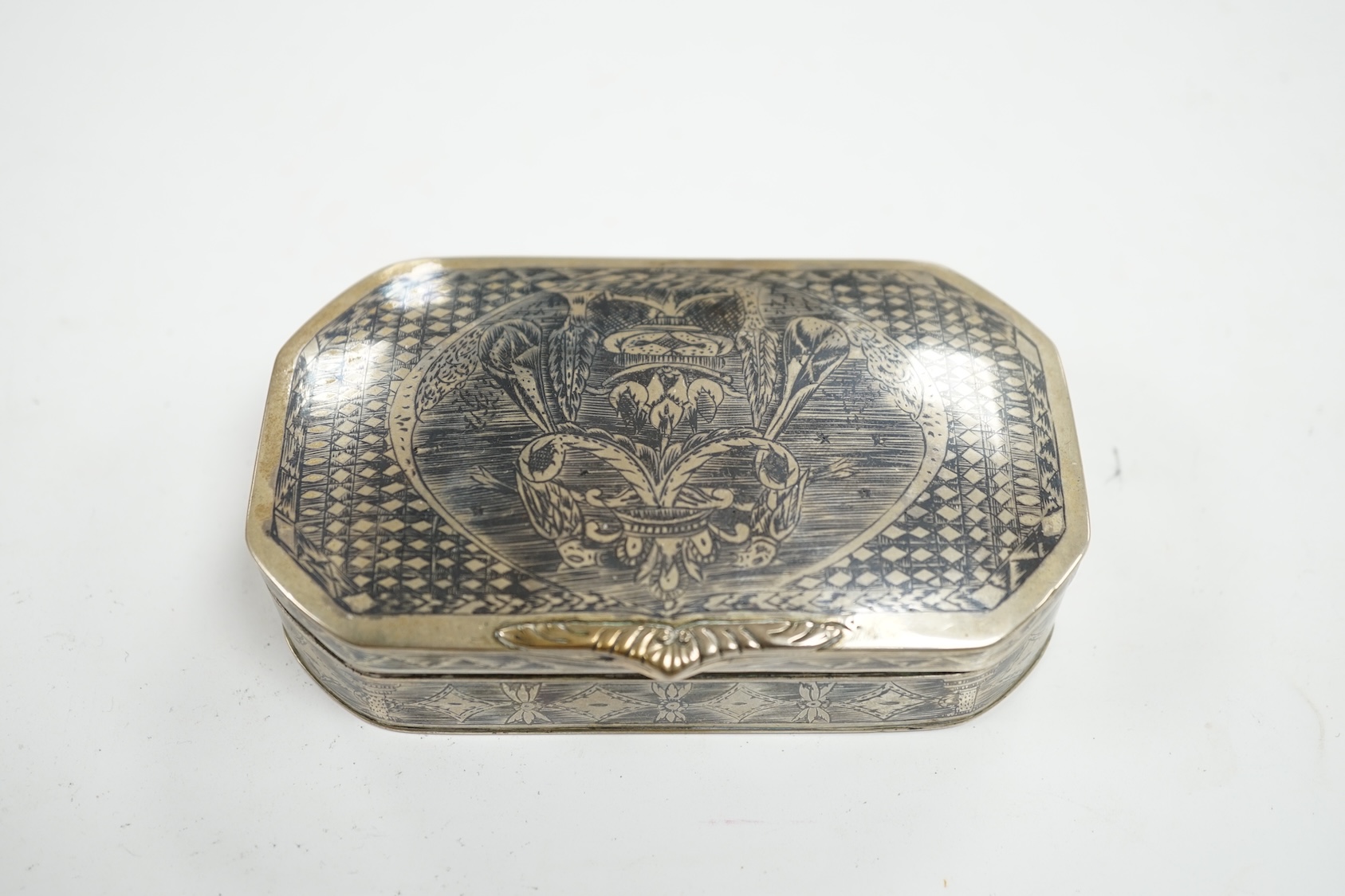 A continental white metal and niello octagonal box, 10.9cm. Condition - poor to fair